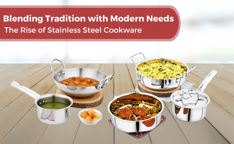 Stainless steel cookware with Indian dishes on wooden table – modern meets traditional kitchenware.
