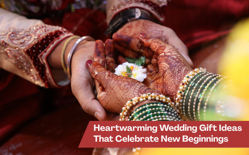 lose-up of an Indian bride and groom’s hands holding a flower during a wedding ritual, with text overlay reading “Heartwarming Wedding Gift Ideas That Celebrate New Beginnings.